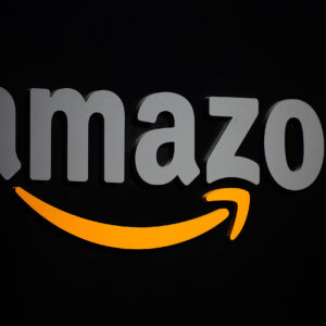 The Amazon logo is seen on a podium duri